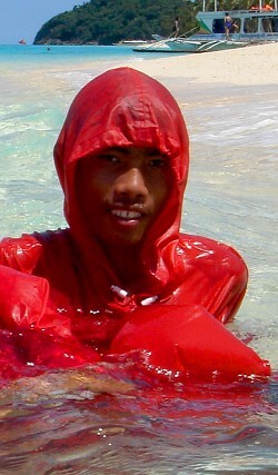 swimming in red hiking cape