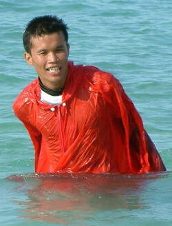 swimming in red poncho