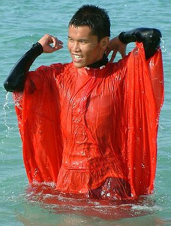 swimming in red poncho